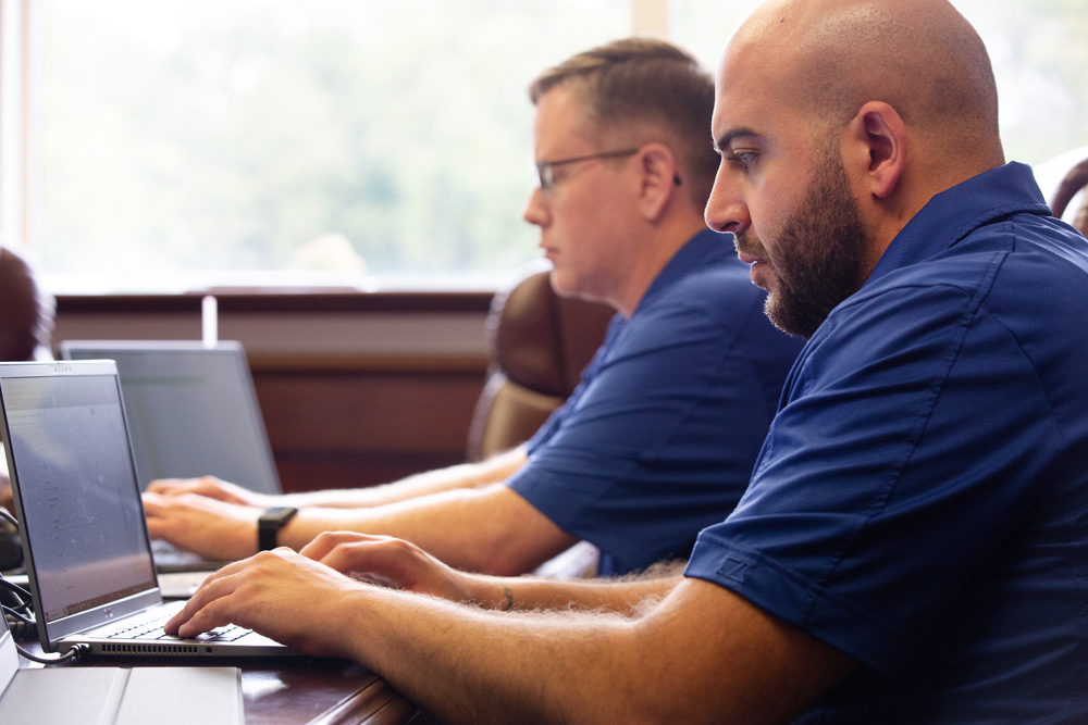 men working on computers